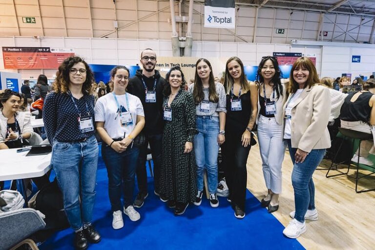 Web Summit attendees pose for a picture at the Women in Tech Lounge at Web Summit 2022