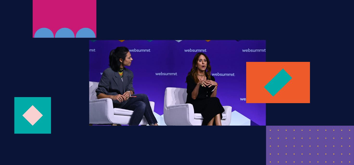 Two female presenting individuals - Stephanie Crespin, Co-founder & CEO, Reflaunt; Alison Loehnis, CEO, YOOX NET-A-PORTER - sitting and talking to the audience while on stage at Web Summit 2022